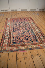 Ivory fringe and patterned lower border of vintage Hamadan rug with blue and peach tones.