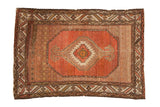 Vintage Hamadan rug with dusty coral serrated medallion, muted multi-tonal field and borders.