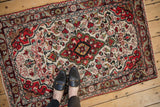 Vintage Dargezine rug underfoot, showing its real-life scale and traditional floral pattern.