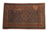 Antique Persian Belouch rug, hook and latch medallion, geometric field in cobalt blue and terracotta hues.