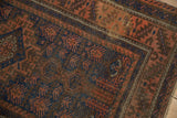 Antique Belouch rug's cobalt blue, terracotta geometric pattern and borders with even pile wear.