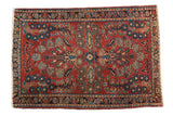 Vintage German Sarouk rug, red field with quatrefoil floral design and indigo border.