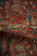 Curled vintage Sarouk rug pile with cherry red, indigo blue quatrefoil blossoms.