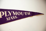 Textured purple felt and cream lettering on the tip of the vintage Plymouth, Mass. pennant.