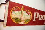 Vintage red felt Provincetown pennant detail showing stitched cream trim and purple ribbon.