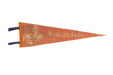 A vintage Niagara Falls Canada felt pennant in faded orange with illustrated graphics.