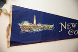 Beige stitched trim and hanging ties on the deep blue vintage felt flag.