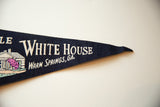 Dark blue felt pennant tip with white 'WHITE HOUSE WARM SPRINGS, GA' text.