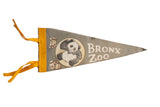 Vintage Bronx Zoo gray felt pennant with panda graphic, yellow ties, circa 1960s, 5x12 inches.