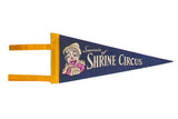 Vintage Shrine Circus felt flag in blue with a classic clown graphic and yellow ties.