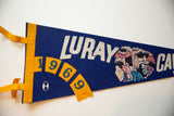 Graphics and 1969 date on a vintage Luray Caverns blue and gold felt pennant.