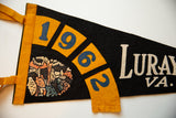 Close view of the 1962 date and cavern illustration on the vintage felt pennant.