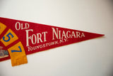 Aged red felt pennant detail with white 'OLD FORT NIAGARA YOUNGSTOWN, N.Y.' lettering.