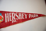 Slightly cracked white lettering on the textured red felt of the Hershey Park pennant.