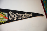 Rope-style script lettering on the black felt of the vintage Marineland of the Pacific pennant.