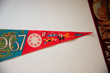 Detailed retro graphics on the red felt tip of the vintage Expo 67 pennant.