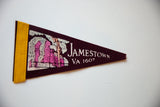 Angled view of the burgundy felt Jamestown VA pennant showing its pink building graphic.