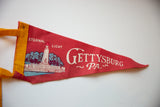 Vintage Gettysburg felt pennant's 'Eternal Light' text, monument, tear, and gold trim.