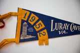 Printed graphic of Luray Singing Tower and 1952 date on a vintage blue felt pennant.