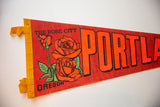Vintage Portland Oregon felt flag with orange roses, green leaves, and 'THE ROSE CITY' text.
