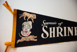 Detailed graphics of a clown, lion, and tiger on the black vintage felt circus flag.