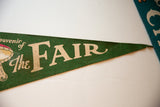 Green felt pennant featuring beige 'The FAIR' text and graphic detail.