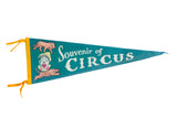 Vintage teal felt circus souvenir flag with clown, lion, tiger graphics, 9x26 inches.