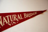 Pointed tip of red felt pennant with cream 