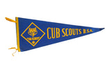 Vintage Cub Scouts BSA felt pennant in royal blue with yellow wolf and lettering.