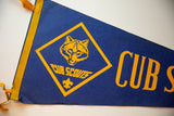 Vintage Cub Scouts felt flag featuring yellow wolf graphic and bold text on deep blue.