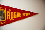 Red felt pennant with bold yellow 'Rogue River Valley' text.