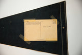 Reverse of vintage Crater Lake felt flag, showing Wizard Island postcard with stamp box and stitching.