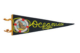 Vintage black felt Oceanside Oregon pennant with seal graphic and yellow rope-style text.
