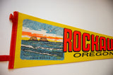 Red felt binding, white stitching, and 'Twin Rocks' graphic detail on vintage pennant.