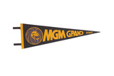 Vintage MGM Grand Reno black felt pennant featuring gold text and lion logo, 8x25 inches.