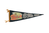 Vintage Old Oregon Historical Museum felt flag with a colorful graphic of a bull-drawn covered wagon.