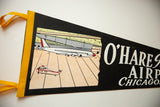 Vintage O'Hare Airport felt flag's yellow border and ties, showing airplane graphic detail.