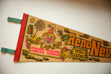 Close-up of the 1970s clown and casino graphics on a vintage Reno pennant.