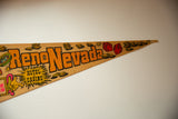 Tapered end of the vintage Reno Nevada felt flag with casino text and graphics.