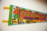 Vibrant retro graphics featuring Paul Bunyan on a felt pennant with light creasing.