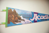 Green felt edge and coastal scene on the vintage Acadia National Park pennant.