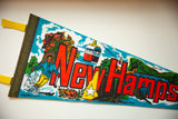 Yellow felt tie and dark stitched border of a vintage pennant.