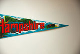 Vintage New Hampshire felt pennant showing red 'shire' text and train graphic with teal waves.