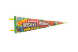 Vintage Hershey's Chocolate World felt pennant featuring colorful retro candy designs, 8x25 inches.