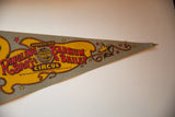 Vintage Ringling Bros circus felt flag with pointed end, rope border and star motifs.