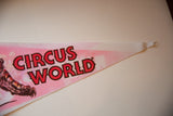 Pointed tip of the vintage circus pennant with red 'Circus World' text.