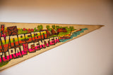 Polynesian Cultural Center felt pennant with vibrant retro huts, canoe, and 