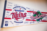 Vintage 1987 Minnesota Twins felt pennant's blue binding and printed player signatures.