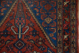 Vintage Hamadan rug detail: sharply serrated contour, brick red, sapphire blue, beige tones.