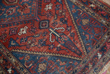 Vintage Hamadan rug: sapphire blue spandrel, serrated contour, and Mahimahi leaves.